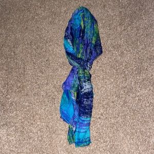 Blue, green and white patterned scarf.